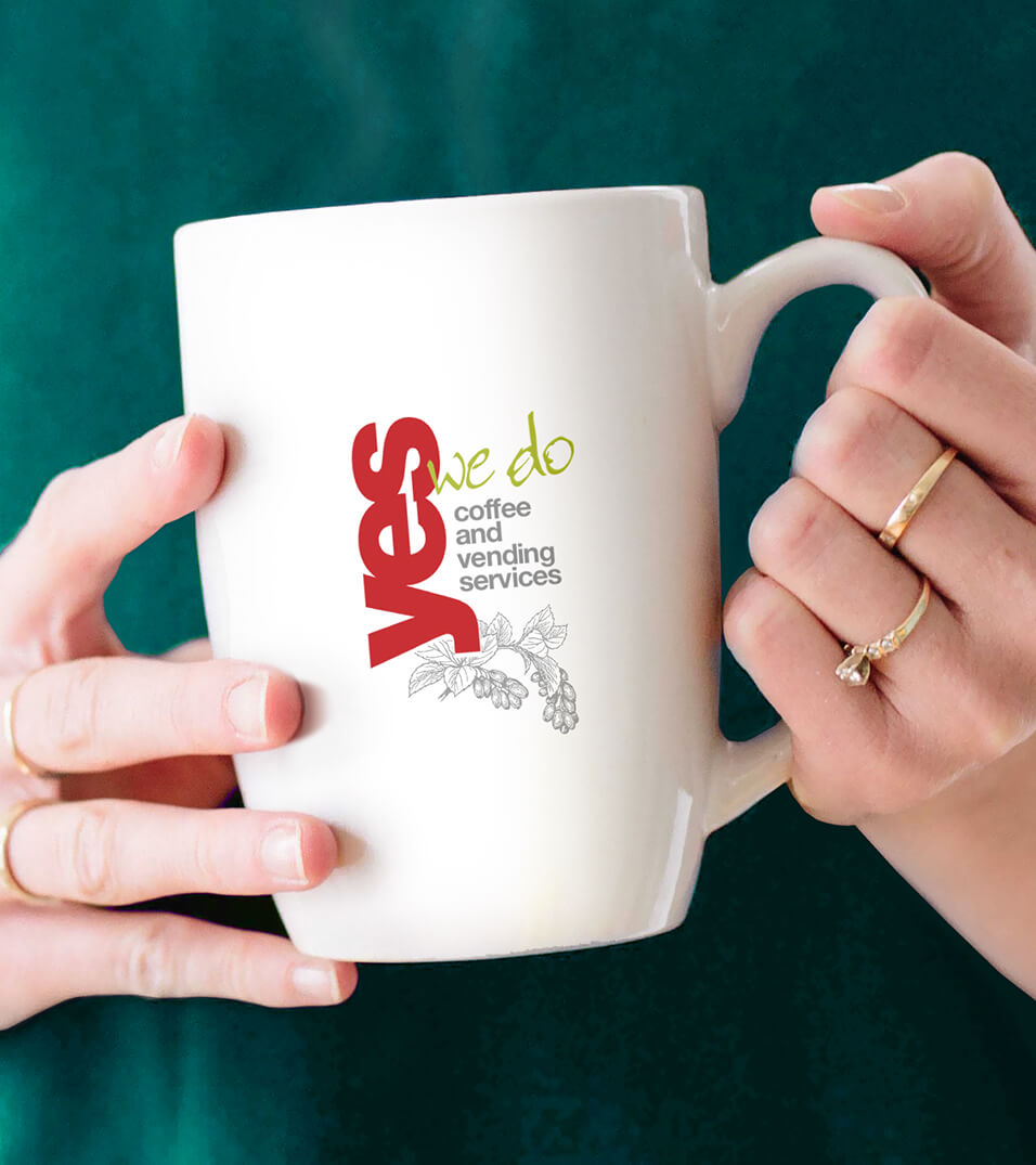 Yes We Do Coffee logo printed on a coffee mug