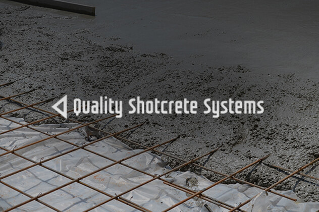 Quality Shotcrete Systems logo above construction site