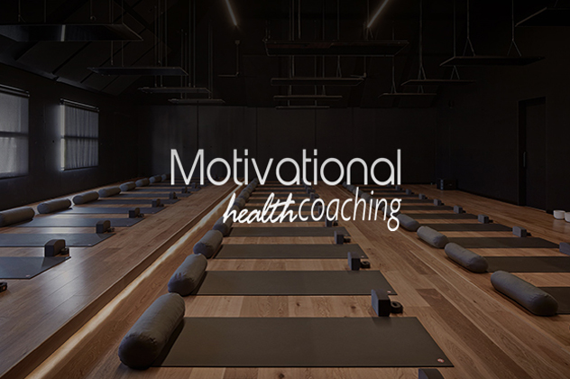 Motivational Health Coaching logo above room filled with yoga mats